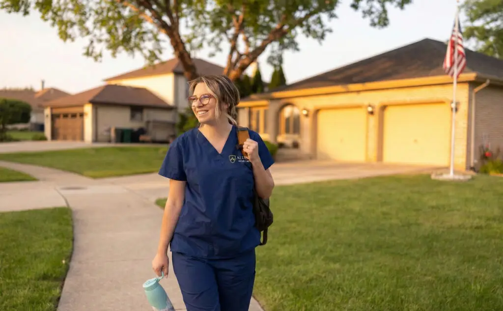 alumni home care caregiver on sidewalk in suburban houston texas