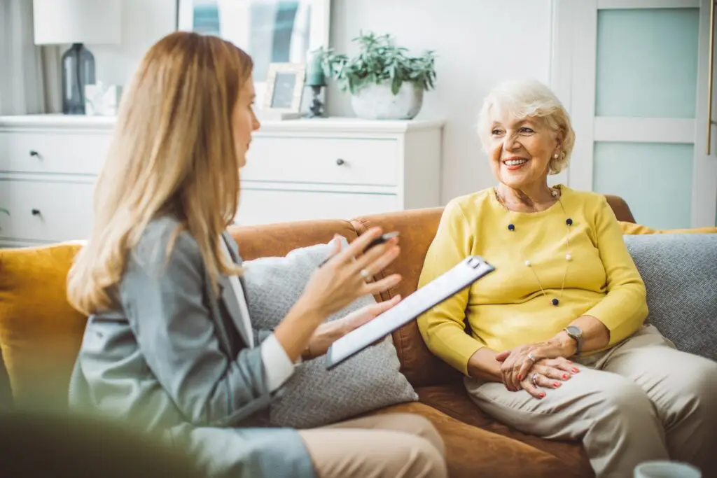 senior home care assessment on couch by alumni home care of houston